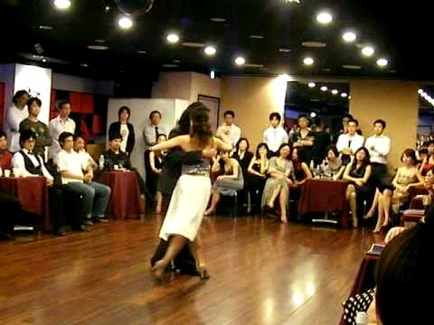  Lily Cheng  and  Raymond Chu  are  dancing  to  the  tango  "  Recuerdo  "