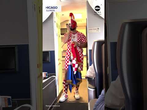 Flight attendant in Croatia kit rallies passengers ahead of World Cup match
