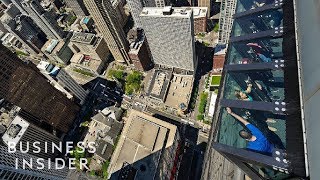 This ride lets you lean out over 1,000 feet above Chicago