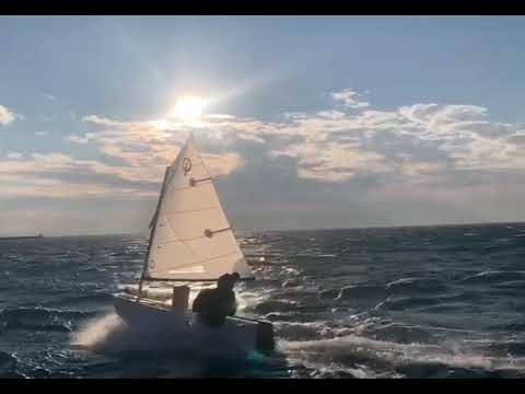 Optimist sailing in windy conditions with CD Sails
