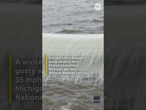 Lighthouse on Lake Michigan freezes into icy wonder after storm
