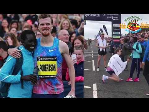 J. Robertson of New Zealand proposes to his Kenyan girlfriend,  Magdalyne, after Great North Run.