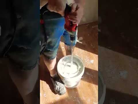 Drill smokes mixing drywall bucket mud