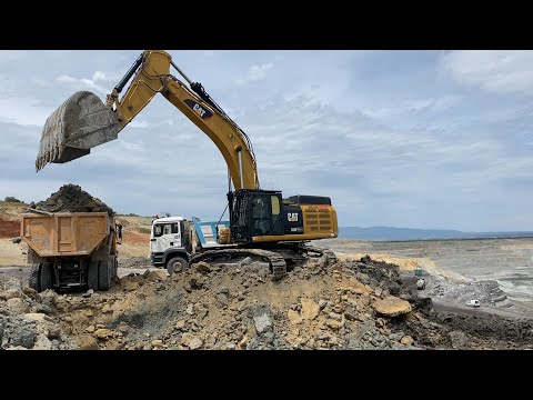 Caterpillar 352F Excavator Loading Trucks