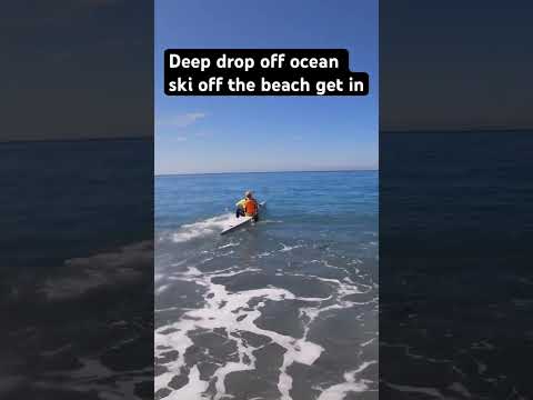 Ocean surf ski beach start. Rocks Deep water