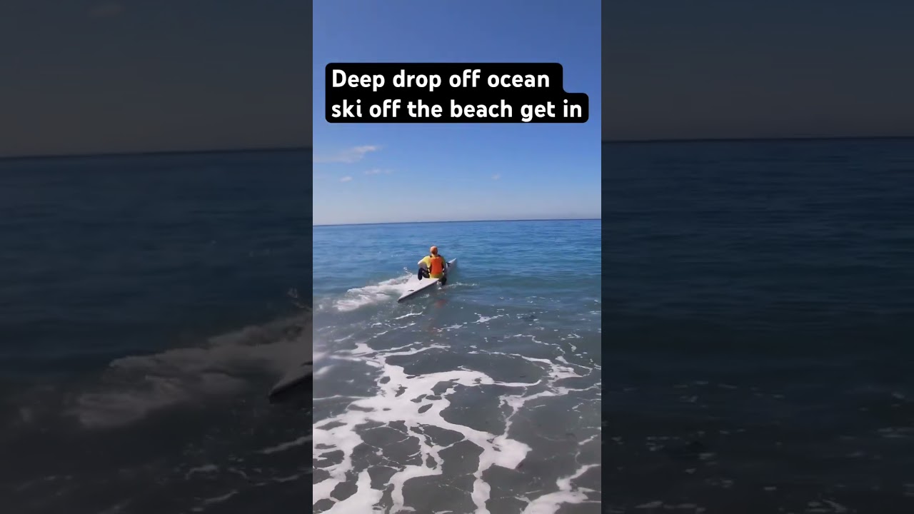Ocean surf ski beach start. Rocks Deep water