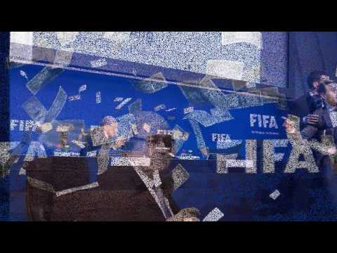 Shamed FIFA president Sepp Blatter is showered in fake dollar bills