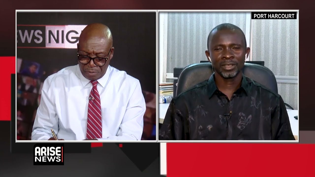 Nigerian health worker administering measles and rubella vaccine to a child