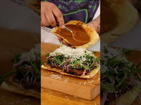 Steak Sandwich with Roasted Bell Pepper Sauce, Dressed Arugula, and Parmigiano Reggiano