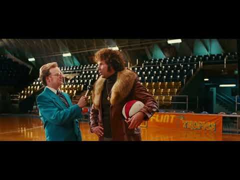 Trailer close-up: Jackie Moon, mic in hand, basking in arena lights