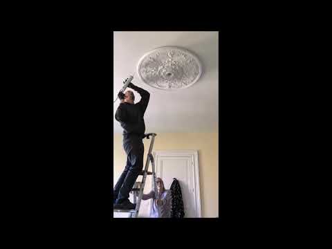 Steve and Angela putting up the Ceiling Rose at Chateau Caillac