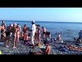 Кормилец охрип, негры предлагают фото. Обычный пляж 26 июля. SOCHI - RUSSIA - 2014 ...