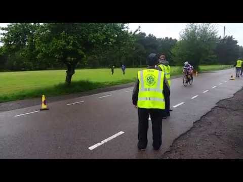 Feeding Bananas to Cyclists at Ironman