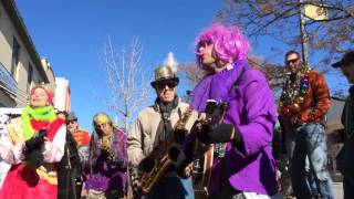 Mardi Gras parade marches through downtown Lawrence