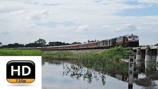 preview picture of video 'DIBRUGARH RAJDHANI races past NFR breaking the silence with a SGUJ based WDP-4B at its helm..!!'