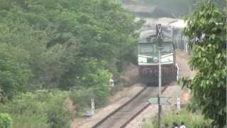 preview picture of video '12431 TVC-NZM Rajdhani Express passing Karmali Station Outer and Crossing Konkan Kanya!!!'