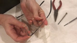 TIGHTEN up a VERY loose arm on a pair of glasses
