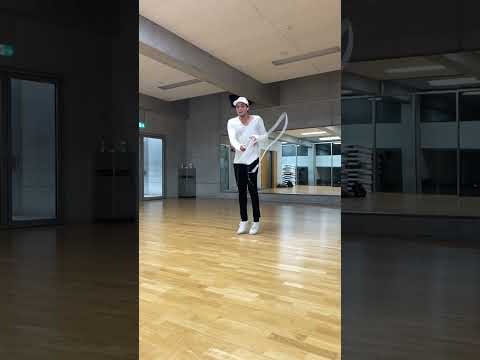 Athlete Jumps High in Air While Spinning Jump Rope With One Hand - 1285097-2