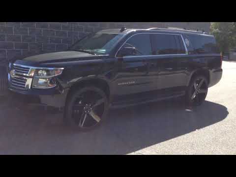 2015 CHEVROLET SUBURBAN SITTING ON 26" DUB BALLER BLACK RIMS AND 295/30-26 CARBON TIRES