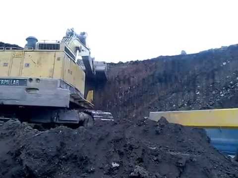 caterpillar 245B loading truck (ptolemaida)