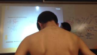 Kid takes off shirt during class