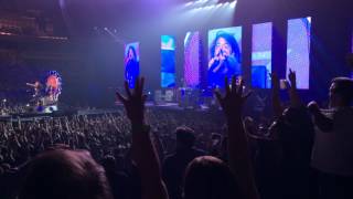 Dave Grohl telling a fan that if she puts her phone down he will get up and dance.