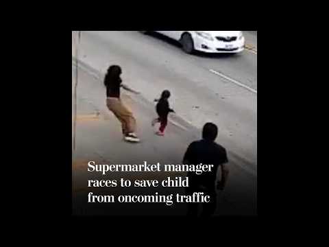 Supermarket manager races to save child from oncoming traffic