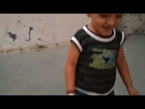 Little Boy Dharmik playing with cat