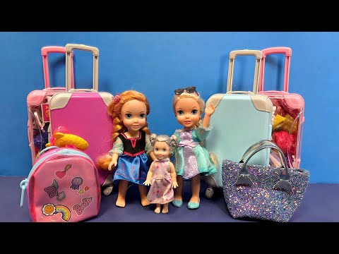 Packing the bags ! Elsa & Anna toddlers - getting ready for a trip - baggage - Barbie dolls