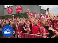 Liverpool fans cheer as Mo Salah penalty gives their team the lead
