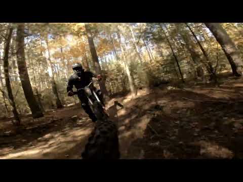DH bike chasing a hardtail on singletrack