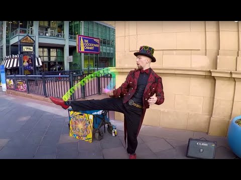 This Street Performer Has Some Of The Coolest Slinky Tricks We've Ever Seen