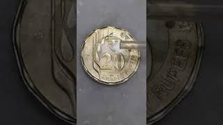 New 20 rupees coin VS water drop.