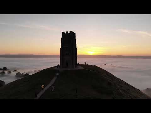 4K HD Stunningly Beautiful Mist flowing over the Glastonbury Tor Tower Glastonbury Tor at Sunset