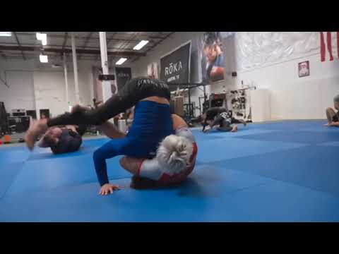 gordon ryan converts an arm in guillotine to a high wrist using his hooks and a shoulder frame