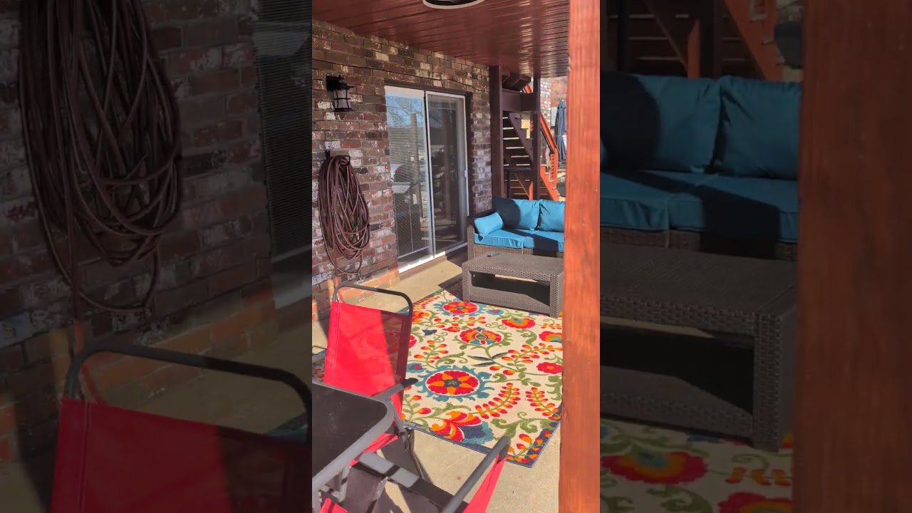 Covered outdoor terrace at LI Airbnb NWA