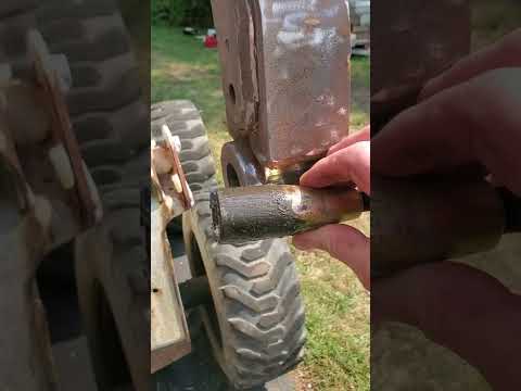 How to remove the pins from a Bobcat Bobtatch... Bottom tapered pins