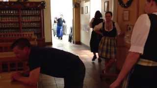 Hofbrauhaus Las Vegas.  Roxanne spanking Chris with a wooden paddle.