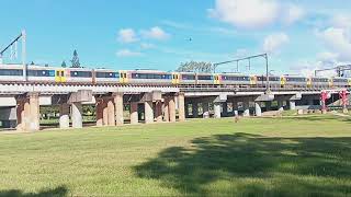 Queensland Rail's NGR unit works on run DY39 past Leis Park into Petrie station on Sat Mar 15.