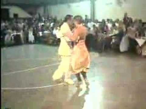  Maricel Giacomini  and  Maximiliano Cristiani  are  dancing  to  the  tango  "  Emancipacion  "