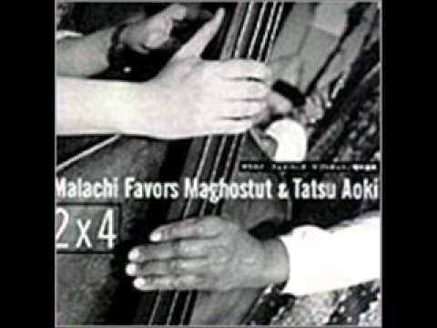 Malachi Favors Maghostut & Tatsu Aoki online metal music video by MALACHI FAVORS MAGHOSTUT