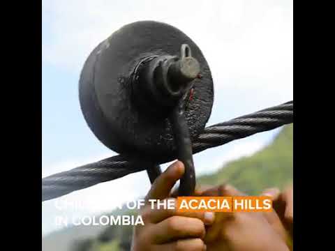 School students from the Acacia Hills in Columbia travelling to school via risky rope way