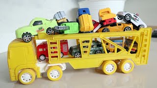 Download lagu Mainan truk trailer mengangkut mobil mobilan mini banyak mp3