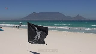 preview picture of video 'Kitesurfers and beachgoers on a windy Cape Town summer day'