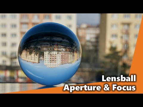 How do different apertures and focus points change the LENSBALL image?