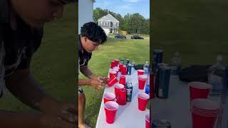 Family plays a Slip and Slide, Flip Cup challenge!