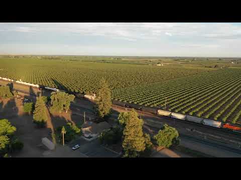 Drone Shoot Train Passing On An Agricultural Land