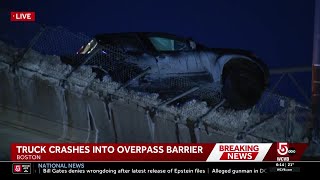 Vehicle left partially dangling over Interstate 93 overpass in Boston after crash
