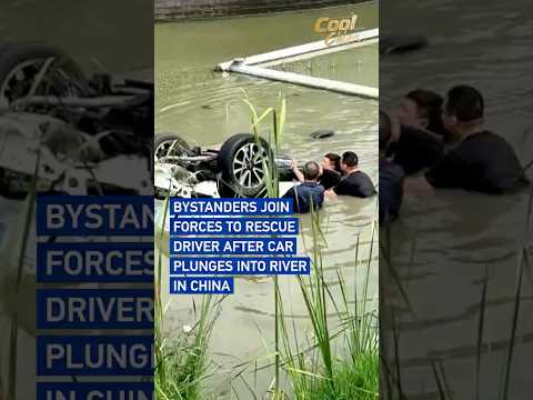 Bystanders join forces to rescue driver after car plunges into river in China #coolchina