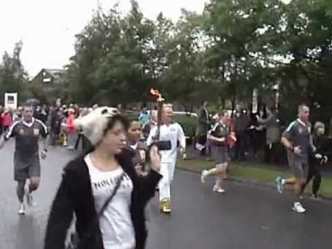 Keith Lemmon carries the Olympic Torch